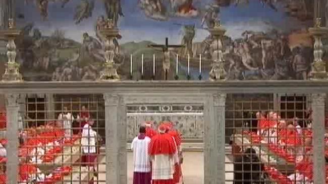 Cardinals queue in line to place their hands on the Gospel to “promise pledge and swear” to keep the oath of secrecy before taking their seats for the conclave to elect the next pope inside the Sistine Chapel in Vatican City. Picture: Picture: AP