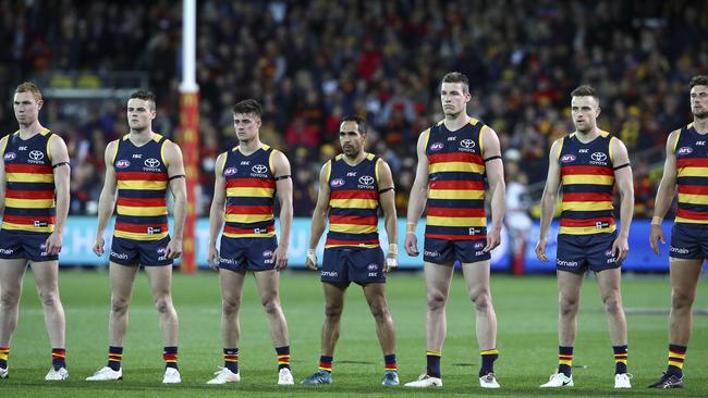 The Crows stand for the national anthem against GWS. Picture: Sarah Reed