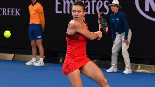 Romania's Simona Halep plays a backhand return to Japan's Naomi Osaka during their women's singles fourth round match on day eight. Picture: AFP.