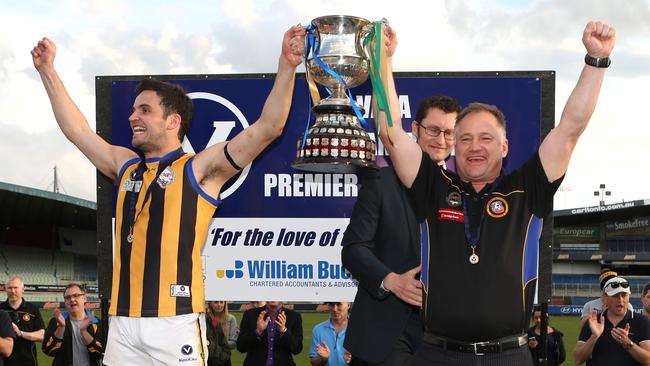 St Bernard's captain Tom Caven and coach Anthony Rock celebrate their premiership. Picture: Stuart Milligan