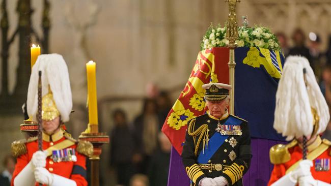 King Charles III stands vigil beside the coffin of his mother, Queen Elizabeth II, as it lies in state on the catafalque in Westminster Hall on September 16.