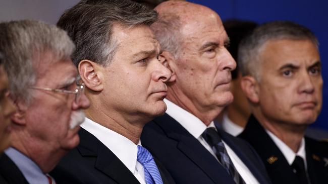 FBI Director Christopher Wray listens during the daily press briefing at the White House, Thursday, Aug. 2, 2018, in Washington. From left also listening are national security adviser John Bolton, Wray, Director of National Intelligence Dan Coats, and National Security Agency Director Gen. Paul Nakasone. Picture: AP.