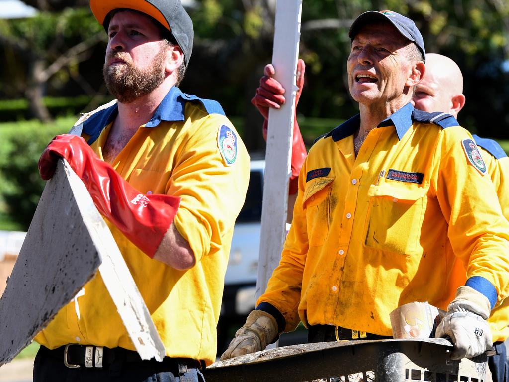 Mr Abbott, right, assisting emergency crews. Picture: NCA NewsWire/Bianca De Marchi