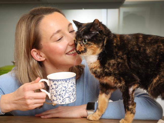 A Whiskers survey conducted with over 500 cat owners has had some interesting key themes emerge, including the impact of cats on pet parents' wellbeing and mental health, and how cats like to play and communicate with their human families. This included cats watching TV and mimicking human eating habits which were also themes which emerged in the survey. Cat owner Georgie Meadows-Patterson has a cuppa with her cat Florence.                      Picture: David Caird