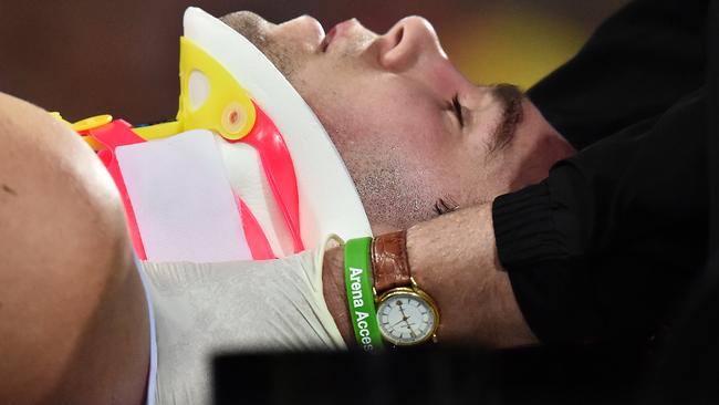 ADELAIDE, AUSTRALIA - JUNE 05: Paddy McCartin of the Saint is stretchered off the field after clashing with Luke Brown of the Crows during the round 11 AFL match between the Adelaide Crows and the St Kilda Saints at Adelaide Oval on June 5, 2016 in Adelaide, Australia. (Photo by Daniel Kalisz/Getty Images)