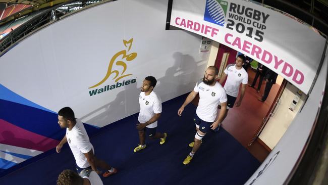 Members of Australia's rugby squad arrive to attend the captain's run at the Millennium Stadium in Cardiff, south Wales, on September 22, 2015, on the eve of their 2015 Rugby World Cup match against Fiji. AFP PHOTO / MARTIN BUREAU RESTRICTED TO EDITORIAL USE