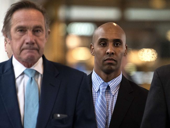 Mohamed Noor, right, pictured arriving at a Minneapolis court, where he was found guilty of murder. Picture: AFP 