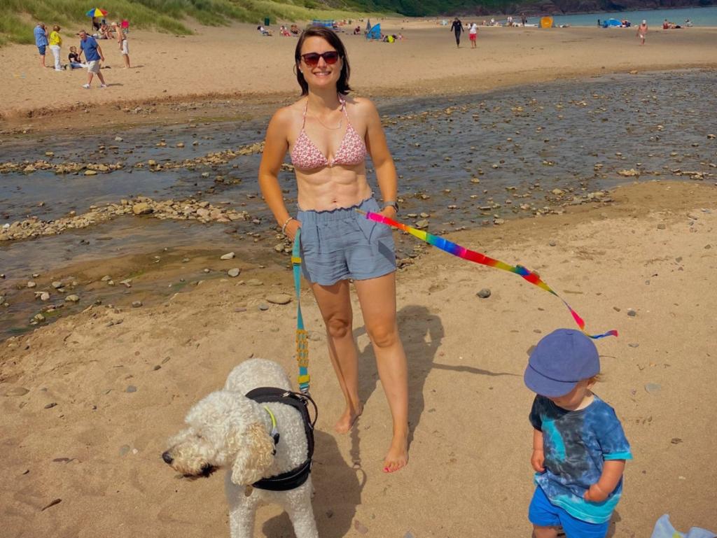 Michelle shared a snap from the beach with her son Zac and her dog with some accusing her of having her child on a lead