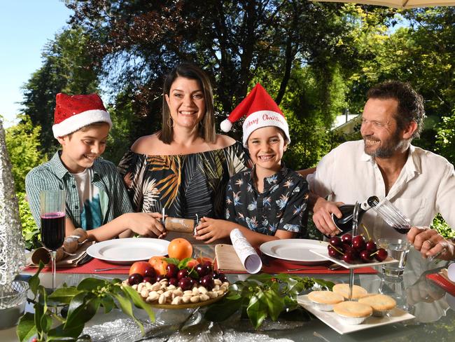 COVID SAFE XMAS OUTSIDE. Louise Pfeiffer with partner Phil Crawford and their children Sebastian 11 and Orlando 8 dining outside in their garden in Stirling. Pictured 22nd December, 2021. Picture: Tricia Watkinson*their Dalmatian dogÃs name is Cassie