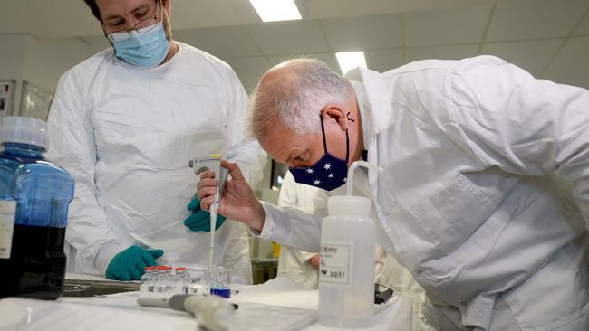 Prime Minister Scott Morrison meets CSL staff working on the COVID vaccine while he tours the company's facility in Melbourne. Picture: NCA NewsWire / Andrew Henshaw