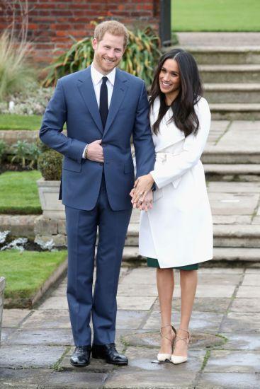 LONDON, ENGLAND - NOVEMBER 27:  Prince Harry and Meghan Markle during an official photocall to announce the engagement of Prince Harry and actress Meghan Markle at The Sunken Gardens at Kensington Palace on November 27, 2017 in London, England. (Photo by Chris Jackson/Getty Images)