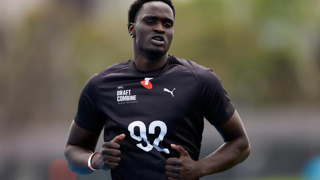 MELBOURNE, AUSTRALIA - OCTOBER 06: Ajang Kuol Mun (Victoria - Geelong Cats (VFL)) competes in the 2km time trial during the Telstra AFL State Draft Combine at MSAC on October 06, 2024 in Melbourne, Australia. (Photo by Dylan Burns/AFL Photos via Getty Images)