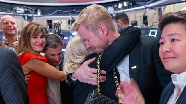 Huffman hugs employees and family on the floor of the New York Stock Exchange. Picture: Spencer Platt/Getty