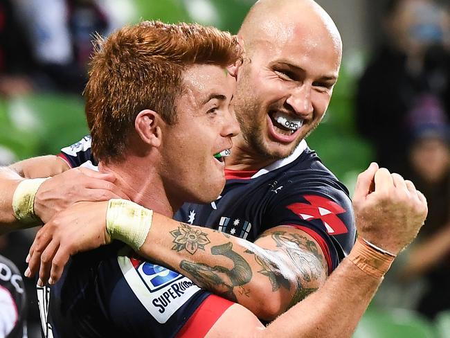 Rebels player Andrew Kellaway (L) celebrates with teammate Bill Meakes (R) after scoring a try during the Super Rugby match between Australia's Rebels and South Africa's Lions in Melbourne on March 7, 2020. (Photo by William WEST / AFP) / -- IMAGE RESTRICTED TO EDITORIAL USE - STRICTLY NO COMMERCIAL USE --