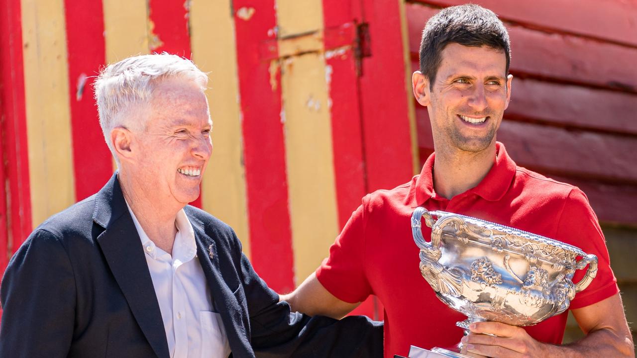MELBOURNE, AUSTRALIA - FEBRUARY 22: Novak Djokovic of Serbia poses with the Norman Brookes Challenge Cup beside Craig Tiley, CEO of Tennis Australia and tournament director of Australian Open, after winning the 2021 Australian Open Men's Final, at Brighton Beach on February 22, 2021 in Melbourne, Australia. (Photo by Andy Cheung/Getty Images)