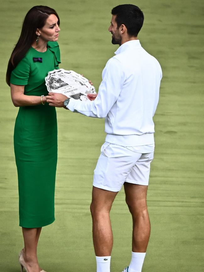 The slightly awkward moment Kate shared with Novak. Photo by SEBASTIEN BOZON, AFP.