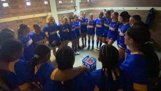 The Sydney U14s take a moment before their match.