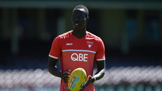 Sydney Swans player Aliir Aliir takes part in light ball drills during an open training session yesterday.