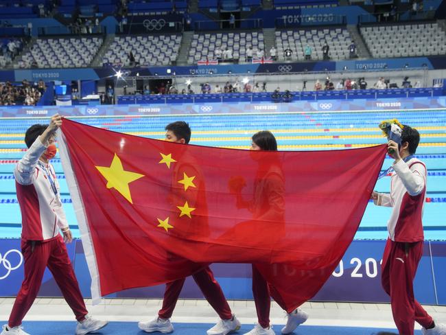 TOKYO, JAPAN - JULY 31: (L - R) Silver medalists Xu Jiayu, Yan Zibei, Zhang Yufei and Yang Junxuan of Team China celebrate on the podium after the Mixed 4Ã100 metres medley relay on day eight of the Tokyo 2020 Olympic Games at Tokyo Aquatics Centre on July 31, 2021 in Tokyo, Japan.  (Photo by Fred Lee/Getty Images)