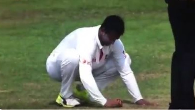 Shakib Al Hasan appearing to rub the ball into the pitch behind umpire Nigel Llong.