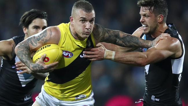 Dustin Martin breaks a tackle against Port Adelaide. Picture: Sarah Reed