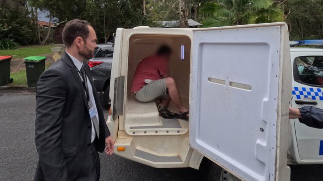 Detectives arrest the man at Safety Beach near Coffs Harbour. Picture: Supplied