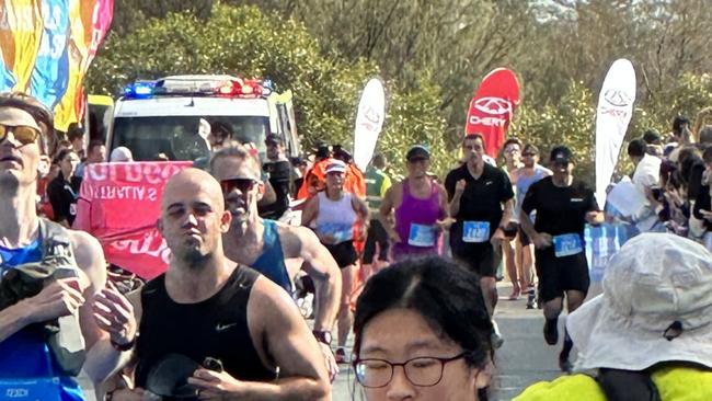 Two Gold Coast Marathon runners were rushed to hospital after collapsing during the race.
