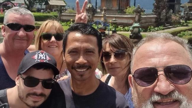 Left to right, back row: Michelle and Brendon Gill on holiday in Legian Bali with their friend Peta Humphires. Left to right front row: Jonny Humpries, Putu, and John Humpries. Picture: Supplied