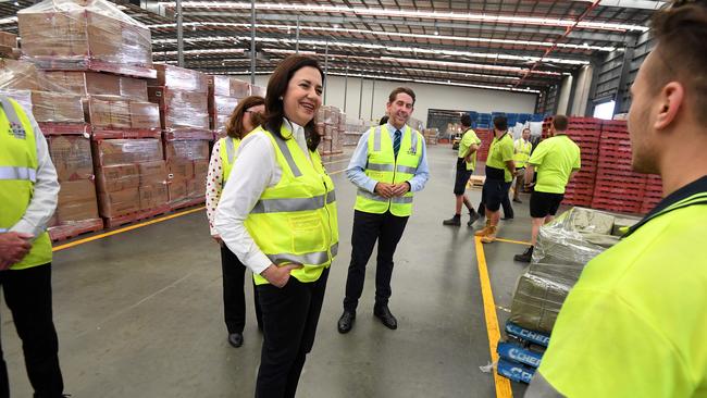 Queensland Premier Annastacia Palaszczuk and Treasurer Cameron Dick talk to workers during a visit to the Port of Brisbane. Ms Palaszczuk today. Picture: Dan Peled