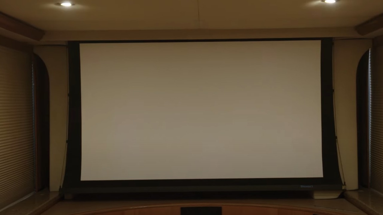 The motorhome has a 30-person cinema with a 100-inch TV. (Picture: YouTube/Ridiculous Rides)