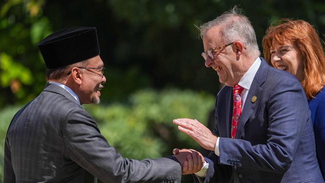 Anthony Albanese welcomes Malaysian Prime Minister Anwar Ibrahim to the Australia-ASEAN summit in Melbourne on Monday. Picture: Getty