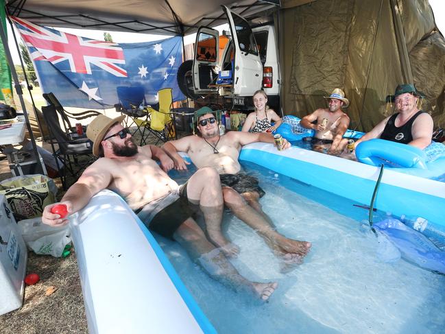 Anthony Carter, Matt Carter, Emily Badger, Joel Muddle and Luke Black pictured cooling off at a music festival campsite on 2019 Australia Day in Tamworth NSW. Picture: Richard Dobson