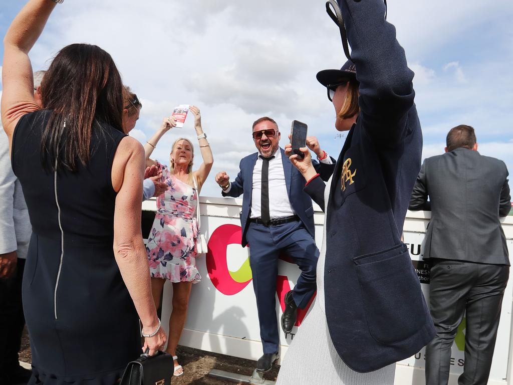 Danny Buzadzic, owner of Western General Bodyworks in Geelong, celebrates the second place of his horse Interpretation. Geelong Cup connections. Picture: Alan Barber