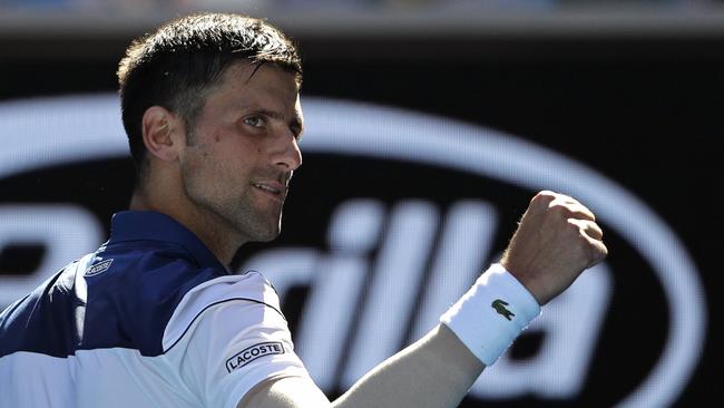 Novak Djokovic celebrates after defeating Donald Young during their first round match at Melbourne Park. Picture: AP