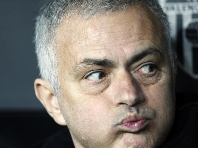 FILE - In this Wednesday, Dec. 12, 2018 file photo Manchester United coach Jose Mourinho looks out from the bench prior a Group H Champions League soccer match between Valencia and Manchester United at the Mestalla Stadium in Valencia, Spain. Manchester United says Jose Mourinho has left the Premier League club with immediate effect. The decision was announced Tuesday Dec.18, 2018, two days after a 3-1 loss to Liverpool left United 19 points off the top of the Premier League after 17 games. (AP Photo/Alberto Saiz)