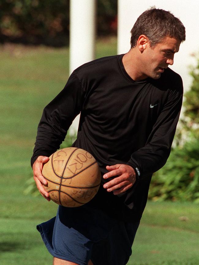 Actor George Clooney on basketball court at Sheraton Mirage.