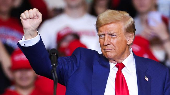 Former US President and Republican presidential candidate Donald Trump leaves the stage after a campaign rally at the Bryce Jordan Center in State College, Pennsylvania, October 26, 2024. (Photo by Charly TRIBALLEAU / AFP)