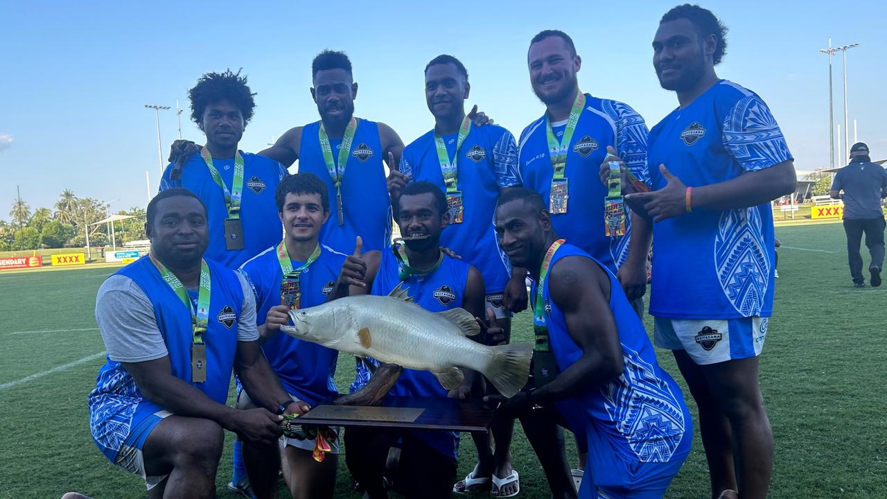 Duiyasana B proudly posing with their Barra trophy following their close final victory. Picture: Lachlan Grey.