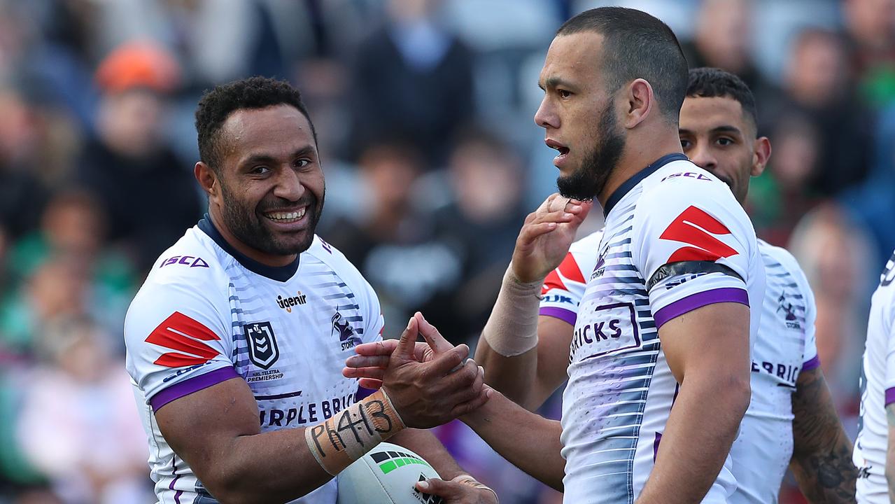 Justin Olam of the Melbourne Storm is congratulated by mate Will Chambers after scoring a try in last year’s competition