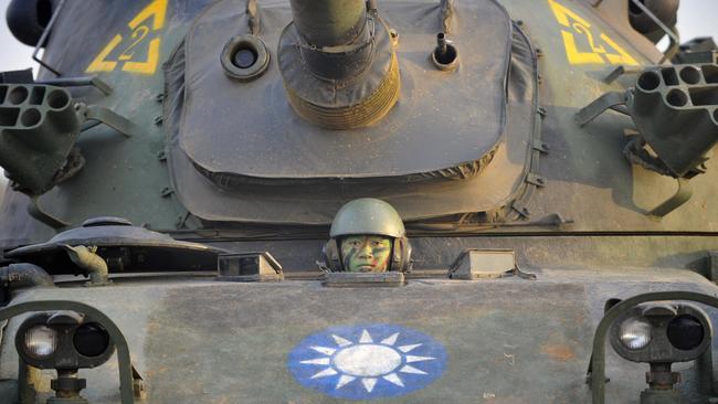 A Taiwanese soldier sitting in a locally made CM-11 tank during a drill. Picture: AFP