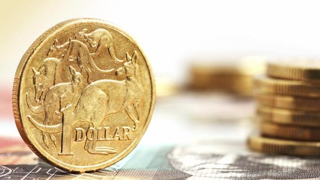 Aussie one dollar coins, on a twenty dollar note.