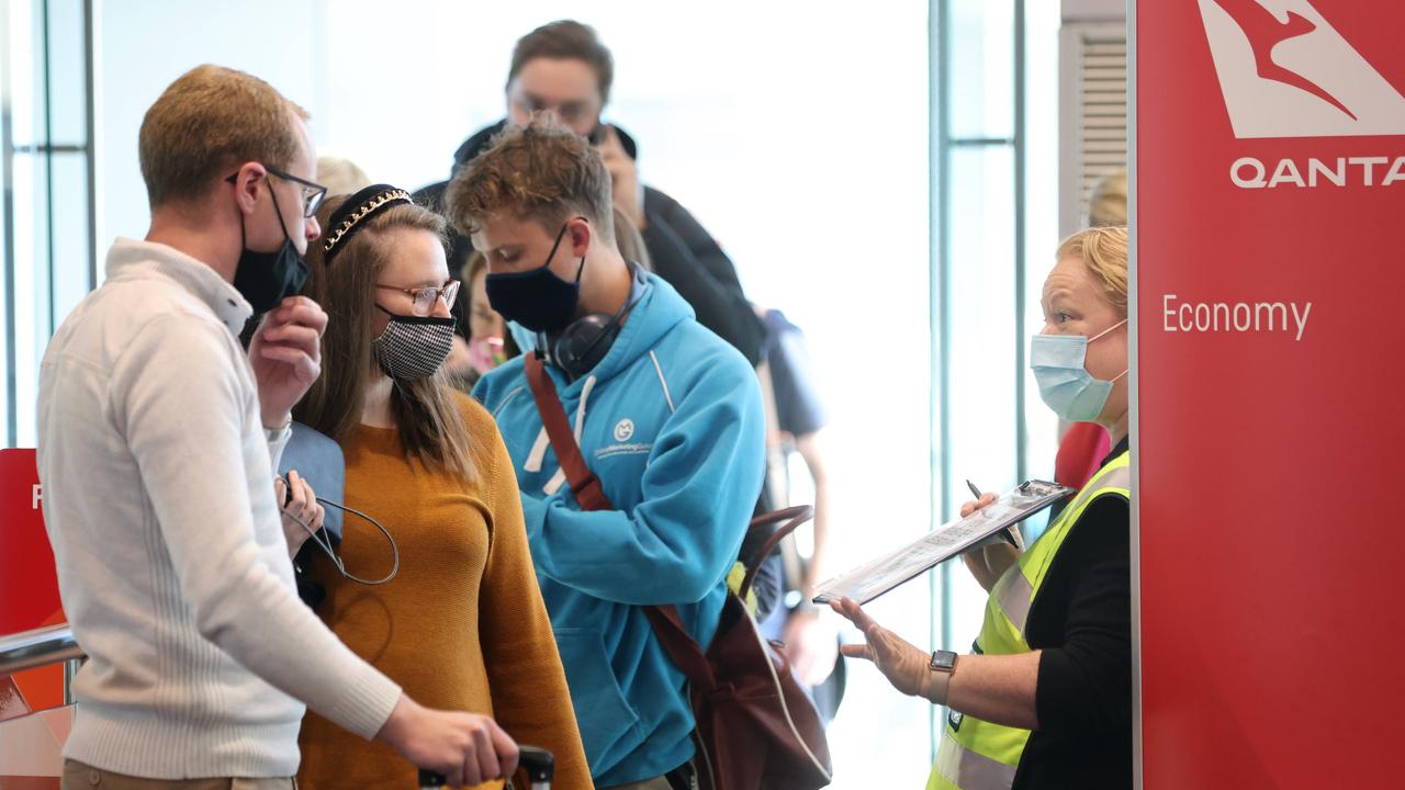 Public health officials checking passengers arriving from Melbourne. Picture: NCA NewsWire / Damian Shaw