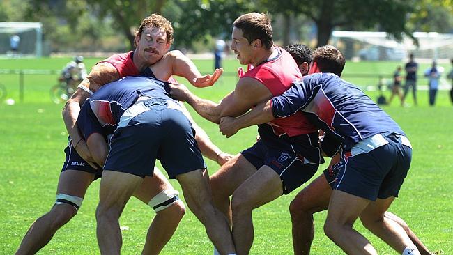 Melbourne Rebels captain Scott Higginbotham wears a stray elbow at training. Picture: Ellen Smith