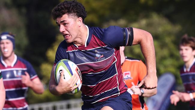 Jojo Fifita of TSS runs with the ball against BBC during their GPS Rugby clash.Photograph : Jason O'Brien