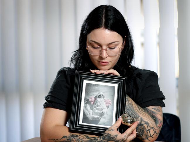 Haylee Loccisano, holding a photo and Urn of her unborn baby Celeste who was killed in a car crash at Ipswich and a 17-year-old girl charged, Springfield Lakes - on Friday 1st of November 2024 - Photo Steve Pohlner