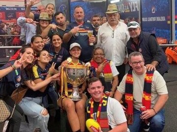 Danielle Ponter celebrates with family and friends, including Essendon great and uncle Michael Long (far right). Picture: Danielle Ponter.