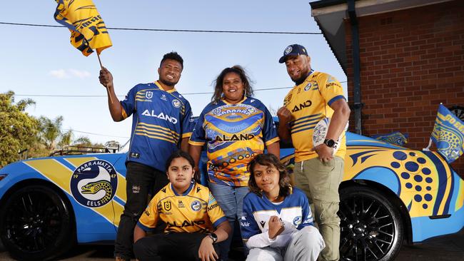 Laiakini Tikoibau (far right) and his own contingent of the Blue and Gold Army; wife Josephine and their children Inia Moses, 13, (left) and Emily, 14, and his brother Alifereti Joji at home in Guildford. Picture: Jonathan Ng