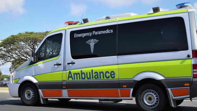 Queensland Ambance paramedics were treating a patient, believed to be the driver of the truck. Picture: Heidi Petith