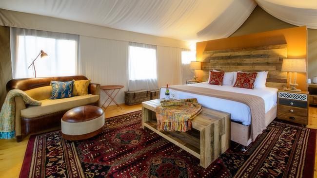 Plush interior of a glamping tent at Truffle Lodge.