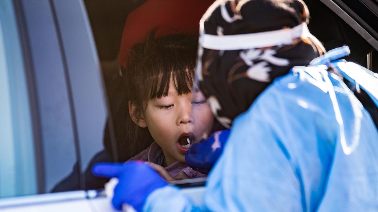 A young girl is being swabbed at a pop up Covid-19 testing clinic at Eight Miles Plains in Brisbane's south, as Queensland remains in lockdown due to a growing covid cluster. Picture: Dan Peled